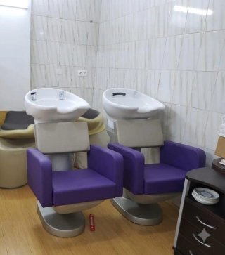 Sillón de peluquería morado