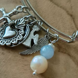 Bracciale con ciondoli religiosi
