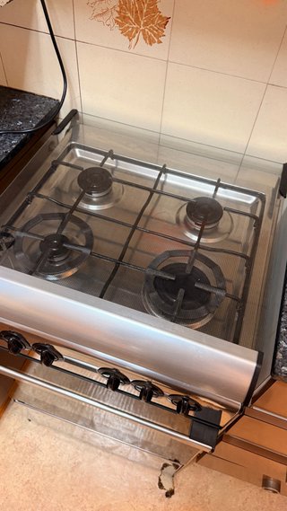 Cocina de gas Rommer 4 fuegos con horno y grill