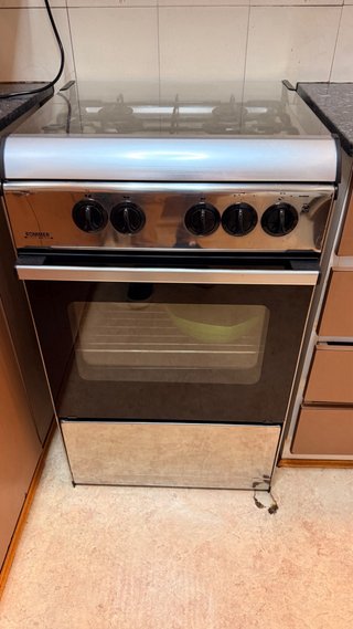 Cocina de gas Rommer 4 fuegos con horno y grill