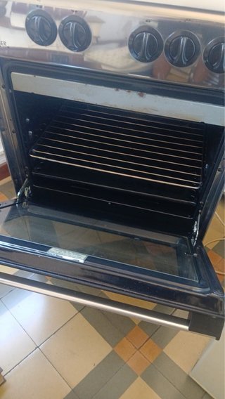 Cocina de gas Rommer 4 fuegos con horno y grill