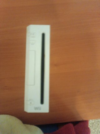 Consola Wii con 2 mandos y 2 juegos