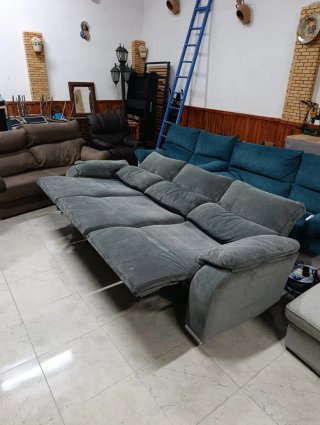 Sillón eléctrico gris y turquesa