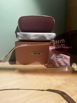 Occhiali da sole Miu Miu dorati rosa