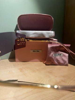 Occhiali da sole Miu Miu dorati rosa