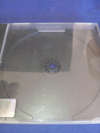 Caja PS1 + Juego Moto Racer (No Funciona)