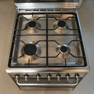 Cocina gas acero inox + horno eléctrico Smeg