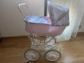 Coche de capota para muñecas rosa