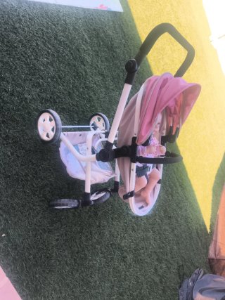Muñeca reborn bebé con carrito y accesorios