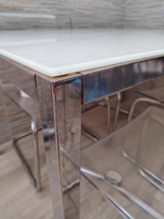 Mesa cristal y 4 sillas transparentes