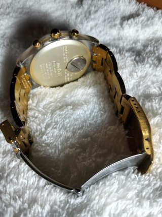 Reloj Swatch Dorado y Plateado