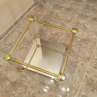 Mesa de centro cristal y metal dorado