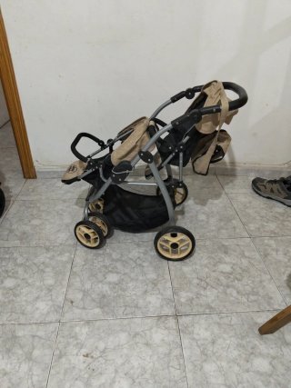 Cochecito de juguete para muñecas