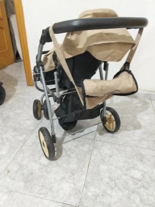 Cochecito de juguete para muñecas