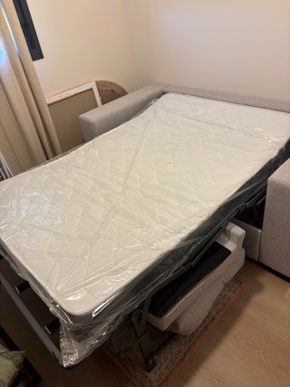 Sofá cama de tela gris