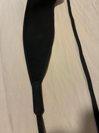 Cinturón tipo fajín negro.
