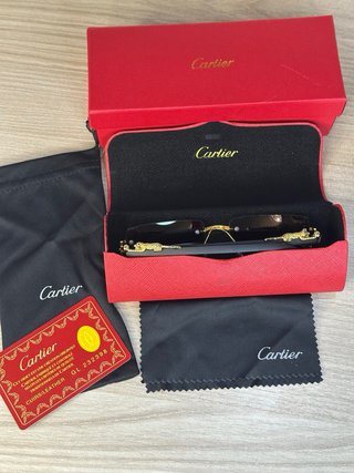 Occhiali da sole Cartier oro