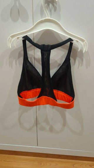 Top deportivo niña/mujer negro y naranja