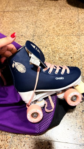 Patines infantiles Oxelo morados con mochila t36