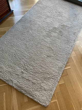Alfombra beige de tela para casa