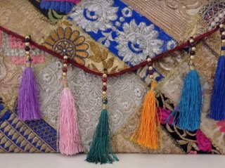 Cartera de mano patchwork con flecos