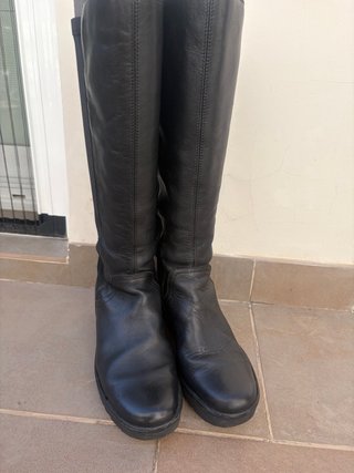 Botas altas de cuña.