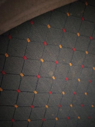 Sillón orejero con funda gris