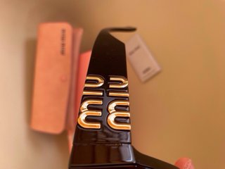 Gafas de Sol miumiu Rectangulares Negras