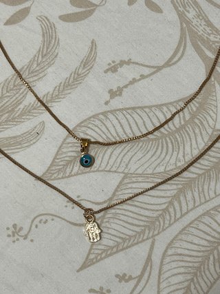 Pack 2 collares dorados ojo y mano