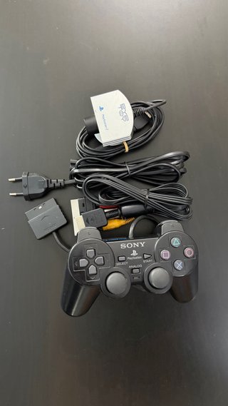 PlayStation 2 con cámara y juegos