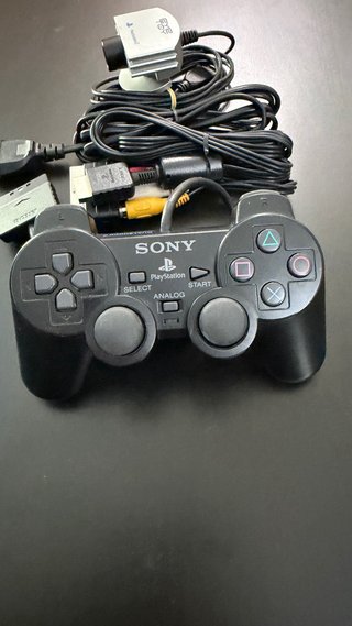 PlayStation 2 con cámara y juegos