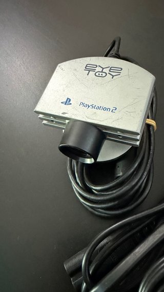 PlayStation 2 con cámara y juegos