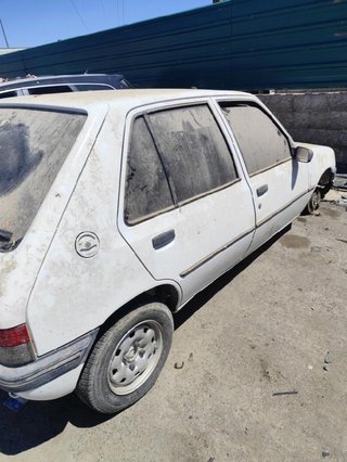 Peugeot 6061 6204a3 faro izquierdo 205 1.1 mt (60
