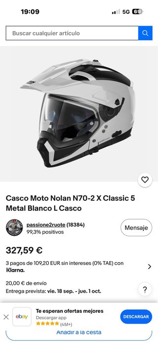 Casco de moto negro y blanco marca nolan n 70 x