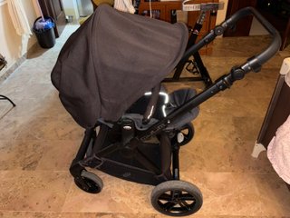 Carrito de bebé doble con plástico protector