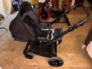 Carrito de bebé doble con plástico protector