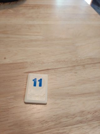 Ficha Rummikub azul número 11