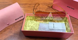 Occhiali da sole Miu Miu dorati e rosa