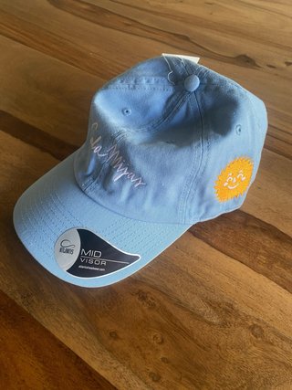 Gorra azul del festival Cala Mijas.