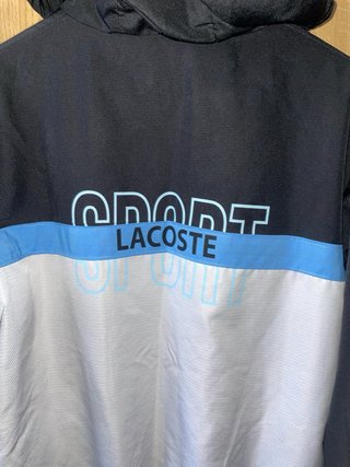 Chaqueta Lacoste Negra, Azul y Blanca