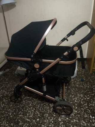 Carrito de bebé con cuco