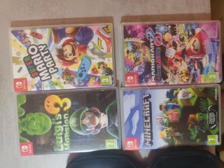 Nintendo Switch + Mando + 4 Juegos