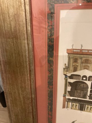 Cuadro antiguo edificio con marco dorado