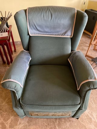 Sillón reclinable de tela verde