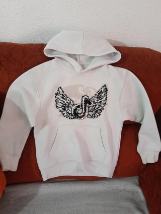 Sudadera niña con alas lentejuelas