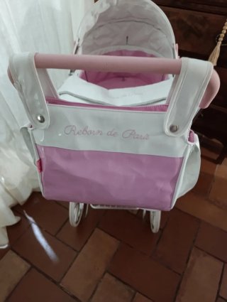 Carrito de muñecas blanco y rosa