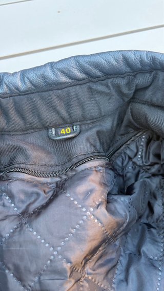 Mono de moto Speed Factory negro y plateado