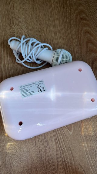 Karaoke infantil rosa con micrófono
