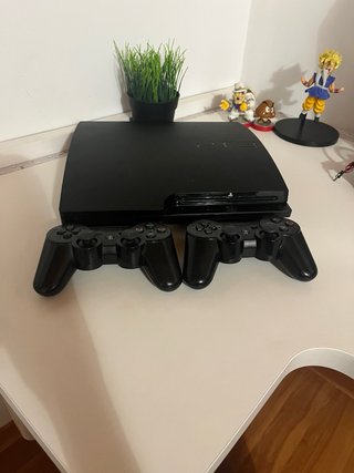 Playstation 3 Slim Negra mas dos mandos +cable.