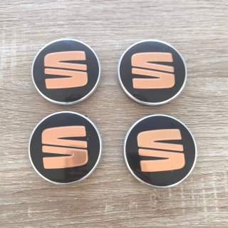 TAPABUJES SEAT 56mm NEGROS CON EMBLEMA COBRE